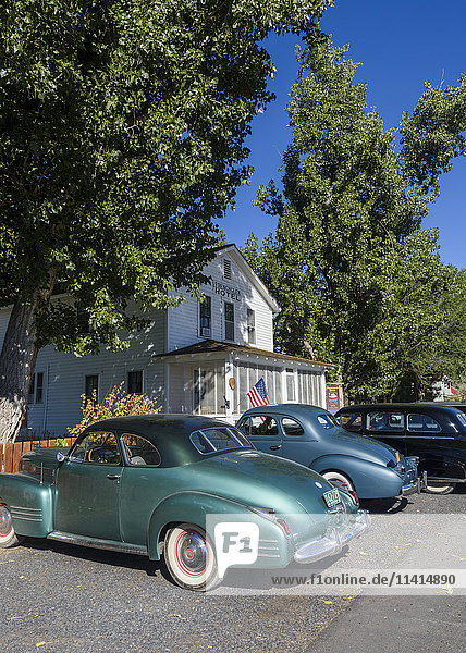 'Classic cars park in front of the Frenchglen Hotel; Frenchglen Oregon United States of America'