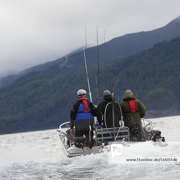 'Fishermen heading out to fish in a boat off the Queen Charlotte Islands; British Columbia  Canada'