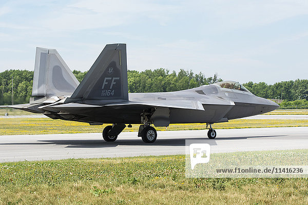 'A stealth F 22 Raptor fighter jet is taxiing out for take-off; Edmonton  Alberta  Canada'