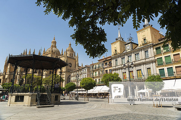 'A church and buildings in a town square; Segovia Castilla Leon Spain'