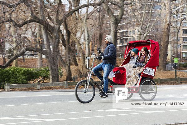 'View of a bicycle taxi in Central Park; New York City  New York  United States of America'