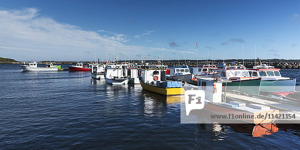 'Colourful fishing boats in the harbour; Main-a-dieu  Nova Scotia  Canada'