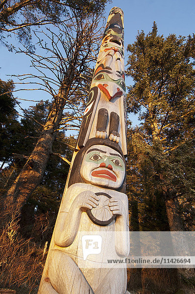 'A totem dedicated to Japanese photographer Michio Hoshino catches evening light in the winter at the Halibut Cove Recreation Area; Sitka Alaska United States of America'