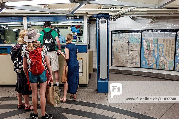 New York  New York City  NYC  Manhattan  subway  MTA  public transportation  59 Street  Columbus Circle  ticket booth  man  woman  line  queue