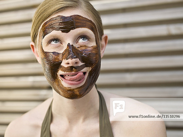Young woman with face pack