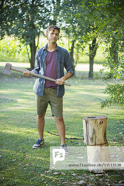Man preparing to chop wood  portrait