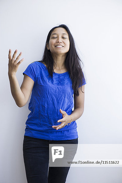 Woman making expressive gestures with hands while talking