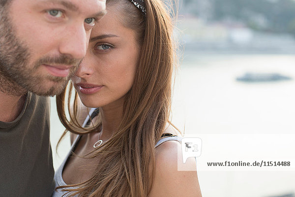 Portrait of sultry young couple on waterfront  Budapest  Hungary