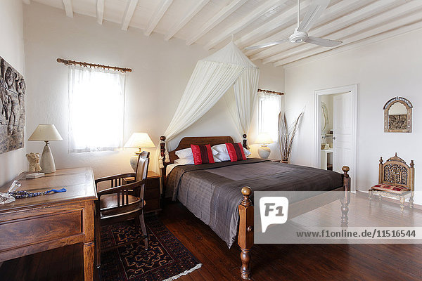 Desk and bed in bedroom