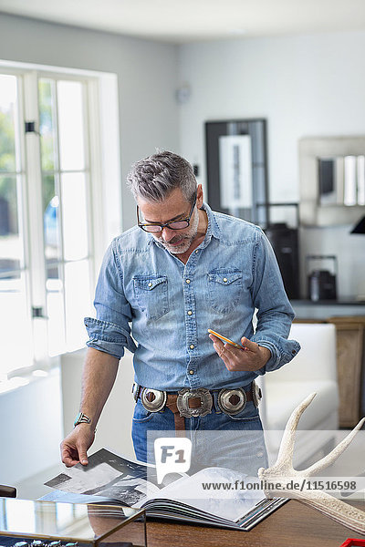 Caucasian man holding staircase reading book