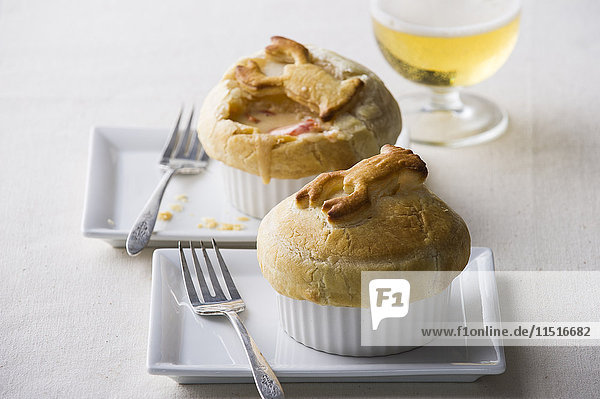 Pot pies with forks on plates