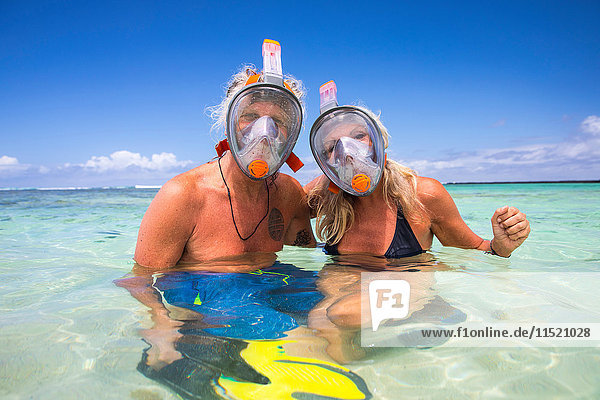 Portrait of mature couple in sea  wearing snorkel  Ile aux Cerfs  Mauritius