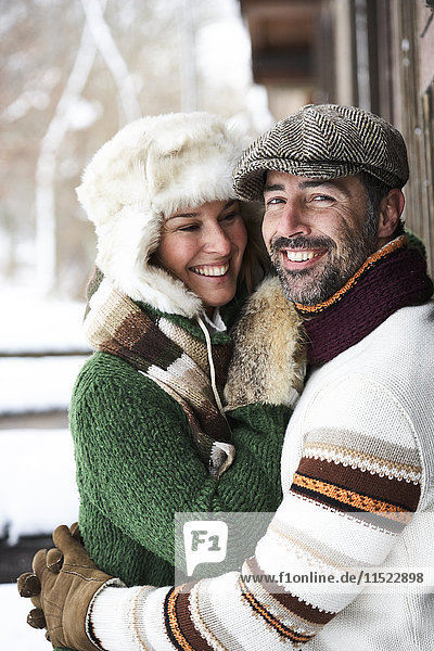Portrait of happy couple wearing winter fashion