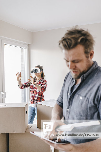 Couple planning their new home  using virtual reality goggles