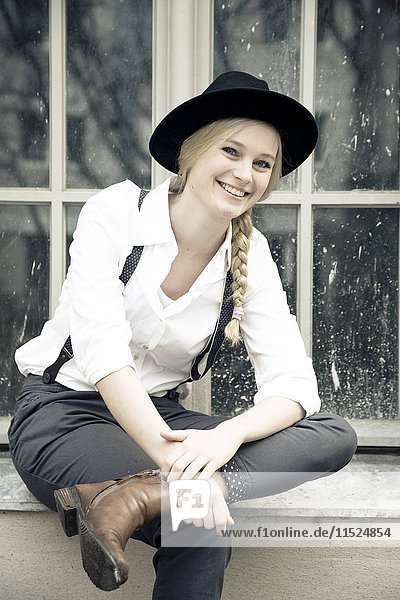 Portrait of smiling young woman wearing vintage clothing