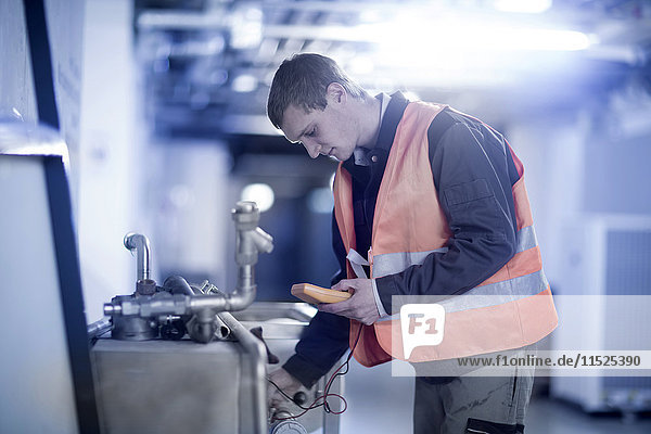 Technician with measuring device