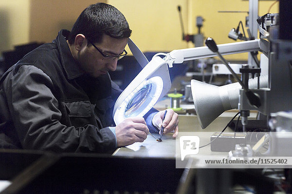 Man working in a sensor technology plant