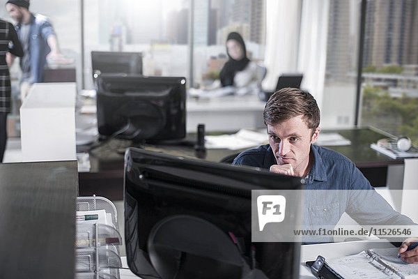 Man working on computer in office