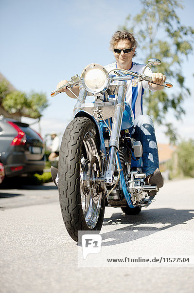 Senior man riding motorcycle