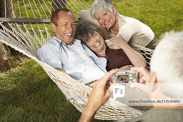 Friends in Hammock Posing for Photograph