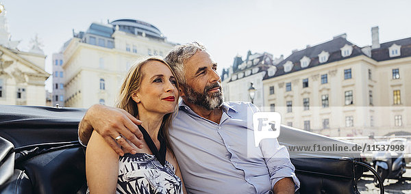 Austria  Vienna  couple in love on sightseeing tour in a fiaker