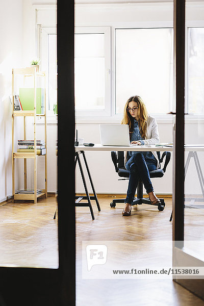 Young woman working at home office