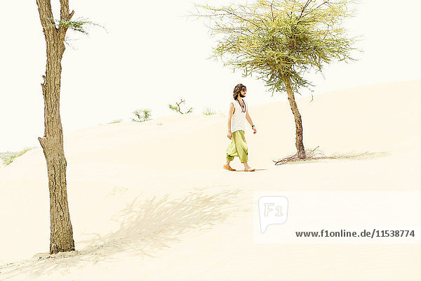 Man walking alone in the desert