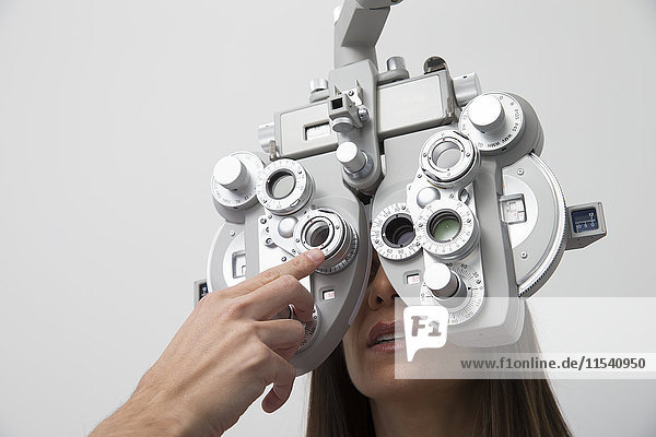 Woman at the optometrist making an eye test