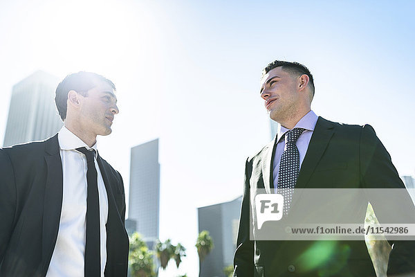 USA  Los Angeles  two businessmen in backlight