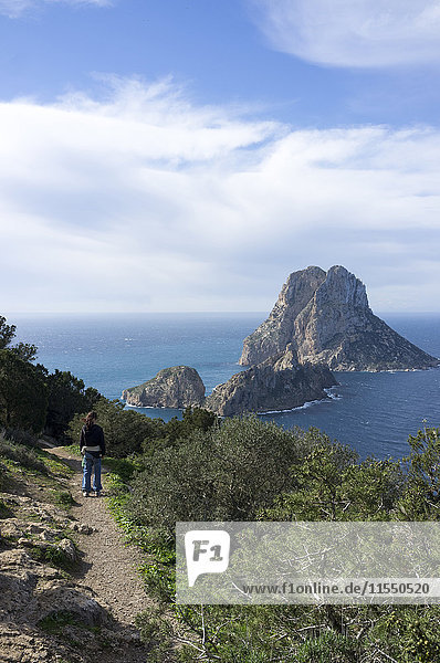 Spain  Ibiza  woman on coastal hiking trail