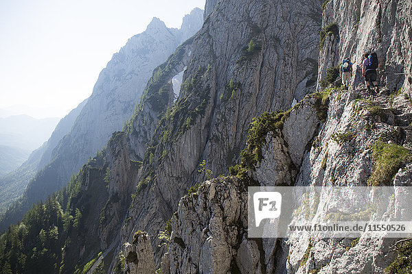 Austria  Tyrol  Wilder Kaiser  two men on via ferrata towards Goinger Halt