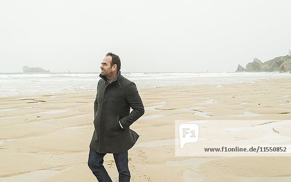 France  Bretagne  Finistere  Crozon peninsula  man walking on the beach