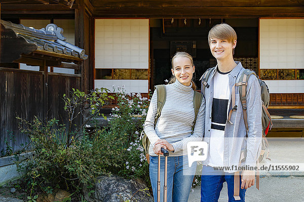 Caucasian couple at traditional Japanese house