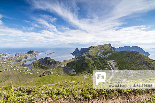 Steep road of curves in between green meadows and sea  Sorland  Vaeroy Island  county of Nordland  Lofoten Islands  Norway  Scandinavia  Europe