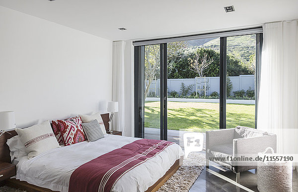 Home showcase interior bedroom with patio doors to garden