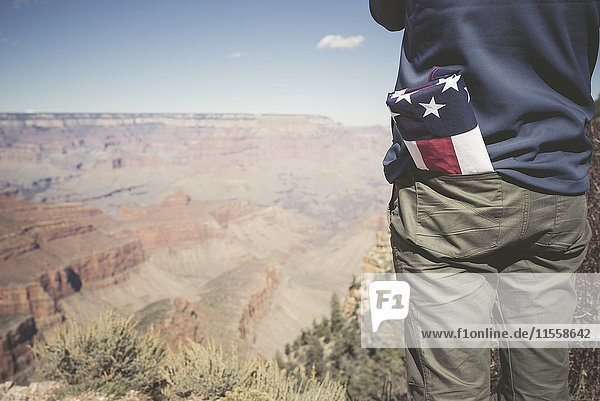 USA  Grand Canyon  man with American Flag in his pocket  partial view