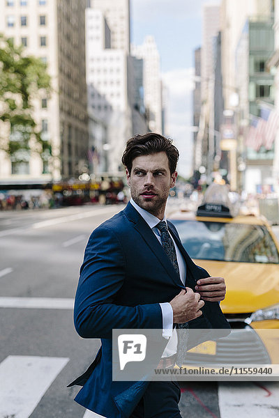 Handsome businessman walking in Manhattan