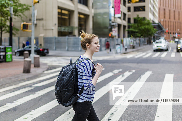 USA  New York City  confident woman walking on the streets of Manhattan