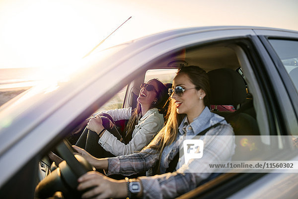 Two young women traveling in a car