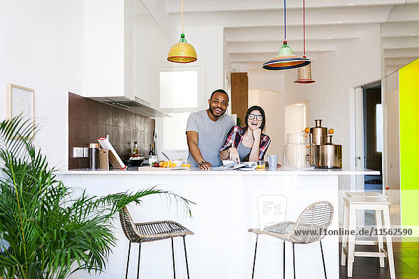 Young couple having breakfast in the kitchen