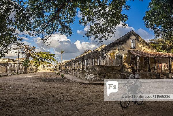 'Local boy cycling on Ibo Island  Quirimbas National Park; Cabo Delgado  Mozambique'