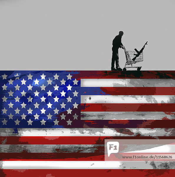 Mann mit Maschinengewehr im Einkaufswagen auf einer US-Flagge