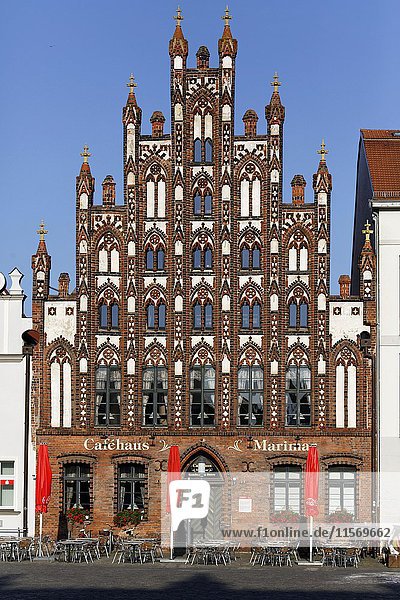 Market Square with cafe  gabled house in historic brick Gothic  Greifswald  Mecklenburg-Western Pomerania  Germany  Europe