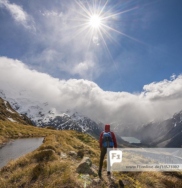 Hiker looking into Hooker Valley  mountain lake Sealy Tarns  Mount Cook National Park  Canterbury Region  Southland  New Zealand  Oceania