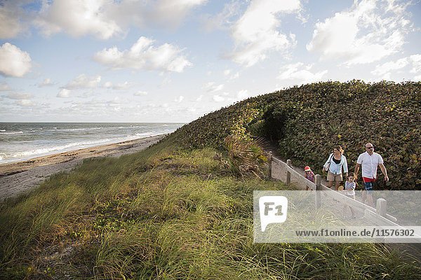 Family walking on coastal path  Blowing Rocks Preserve  Jupiter  Florida  USA