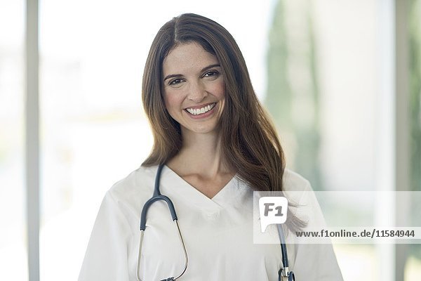 Female medical professional smiling towards camera  portrait.