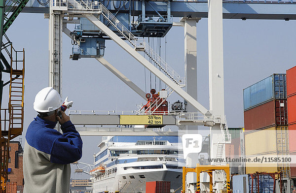 Engineer on site at shipping port.