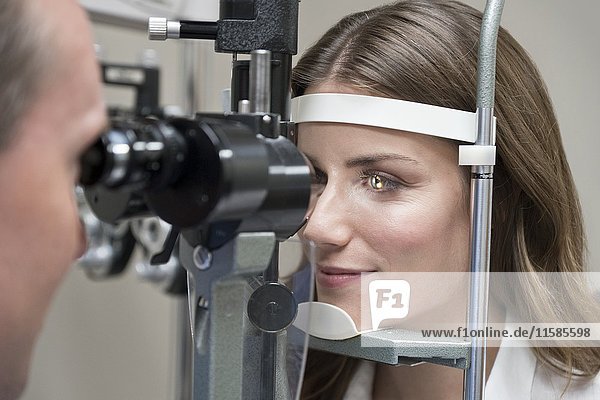 Mid adult woman having eye test.