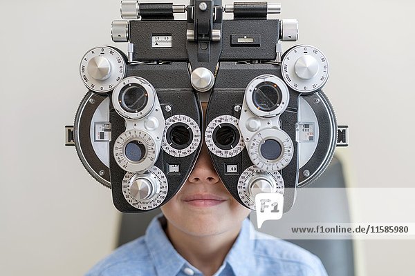 Boy having his eyes tested.