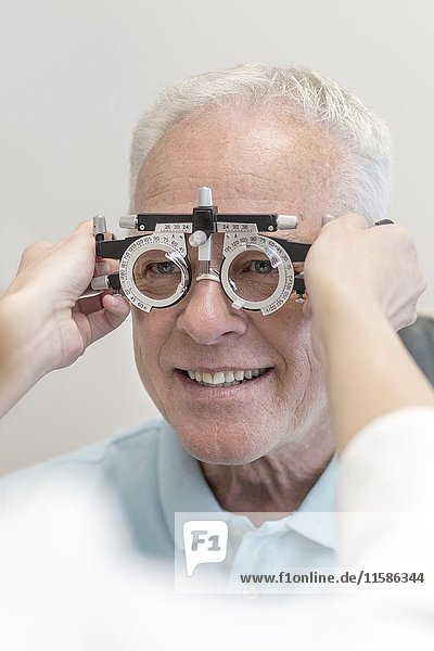 Senior man having his eyes tested.